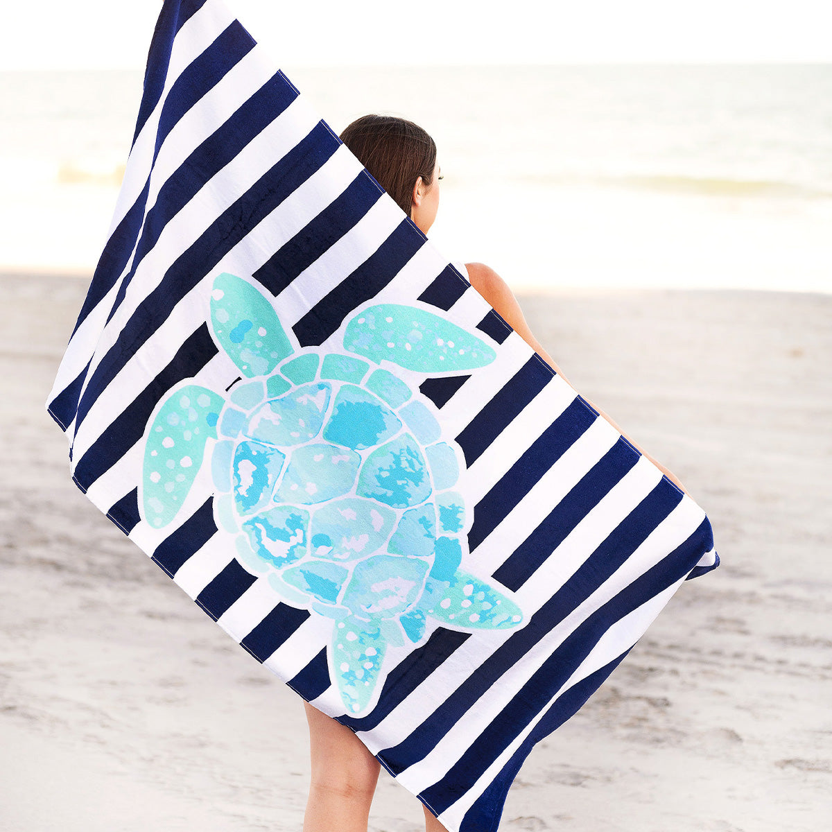 https://redbirdgifts.com/cdn/shop/files/M1000VL-STTUR23_Turtle-Stripe-Beach-Towel_2-1_1400x.jpg?v=1683405929